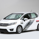 Illustration for article titled A Honda Fit With A Grom In The Back Is Something We Need Yesterday